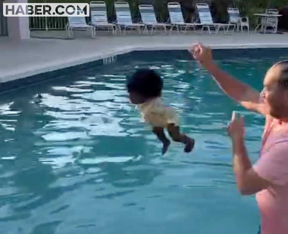 11 Aylık bebeğe yüzmeyi böyle öğretiyor